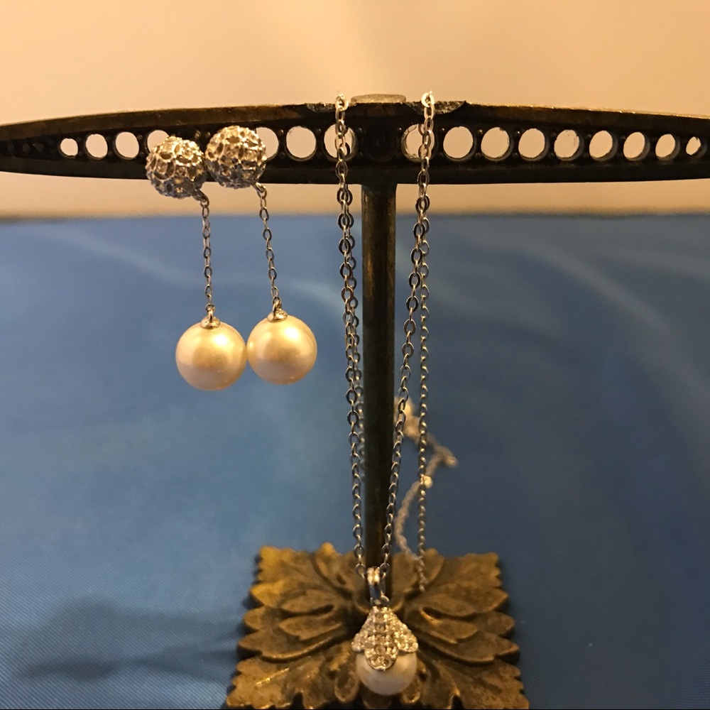 Pearl necklace and earrings.